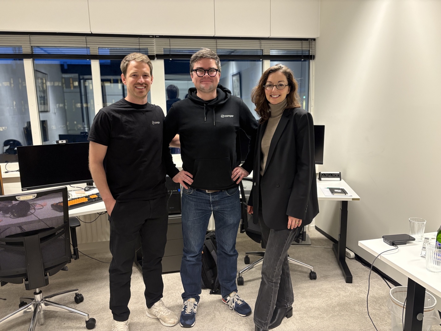 Comper team with guest in the office