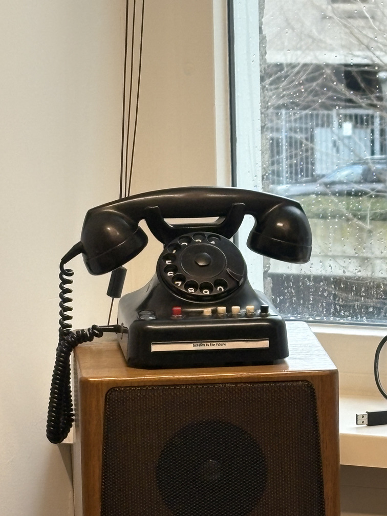Vintage telephone on speaker in Comper office